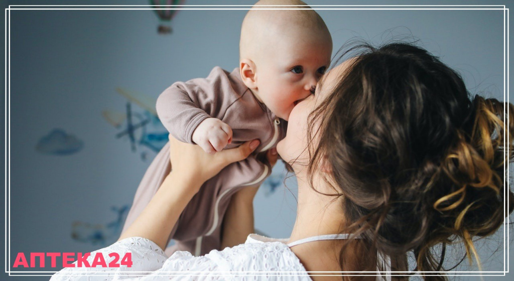woman-in-white-top-carrying-baby-in-brown-onesie-3875225 (2).jpg